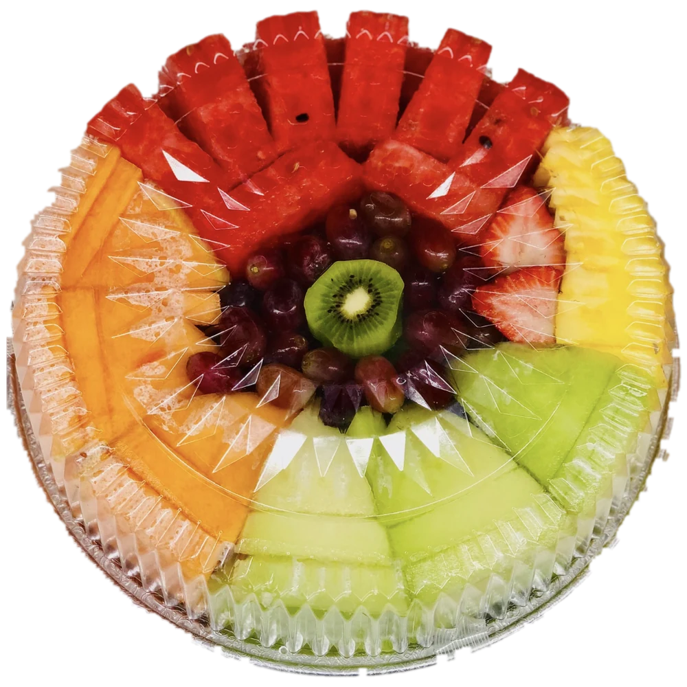 A Friendly Food Mart fruit tray under a clear lid: watermelon, cantaloupe, honeydew, pineapple, strawberries, grapes and kiwi.